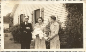 Valle Wallace holding baby Kathryn Wallace with grandparents of Kathryn, Rev. T. L. Bess and Mrs. Emma Bess. Benton, Missouri.