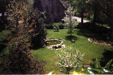 Bench by Goldfish pond seen from Wardens Room window in Taylor Hall
