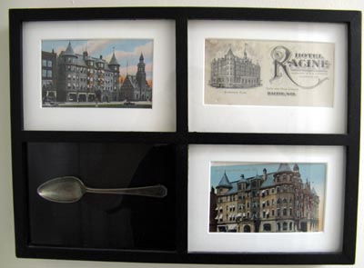 A Hotel Racine shadow box, containing two postcards, letterhead, and a Hotel Racine spoon