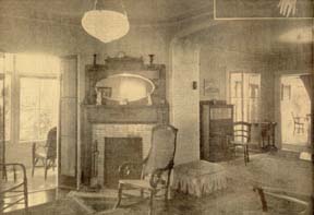 The fireplace which Mrs. Winship insisted on having moved (in spite of the anguished protests of the carpenters) remains just where she had it placed, and draws beautifully, too. At the far left, a glimpse of the veranda, looking through the trees toward the lake. At the right, a portion of the second sitting room which adjoins the library. At the extreme right, a bit of the dining room, and, barely visible, a still life painted by Col. William Utley. Daguerrotypes and portraits provide footnotes to Racine history.