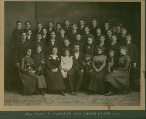 This is the Henry Schullte Violin Class 1899-1900.  And that's my grandfather Max Bernhardt in the bottom row, 2nd from the right, holding a violin.