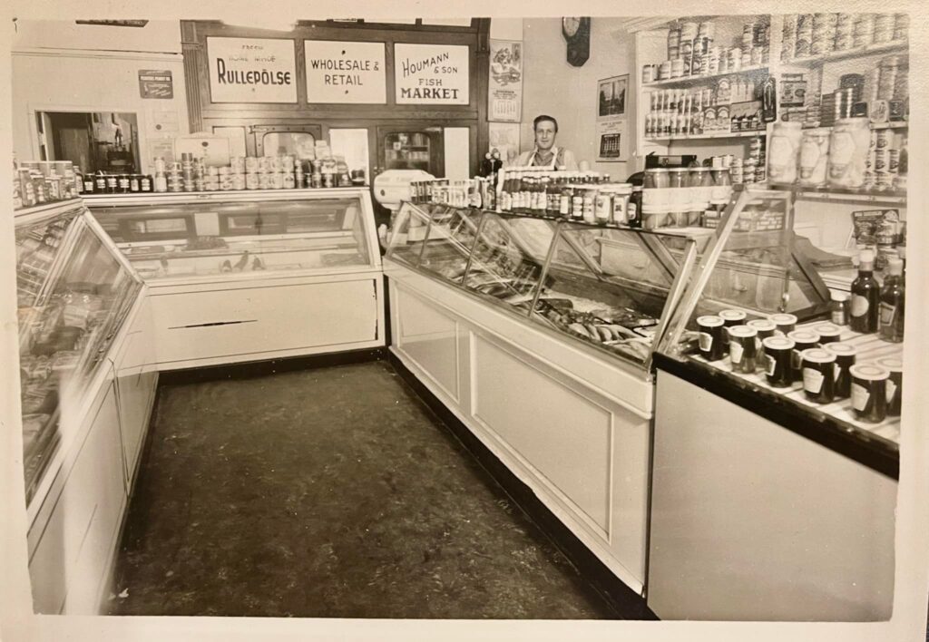 Interior view of Houmann & Son Fish Market, ca. 1950s
James Waschbisch: My wife Becky stumbled upon this photo of her Grandfather working at Houmann’s Fish Market ~ 1950s